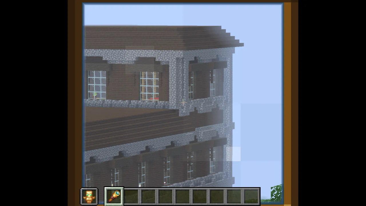 Player using a Spyglass to zoom in on a distant Woodland Mansion across an ocean